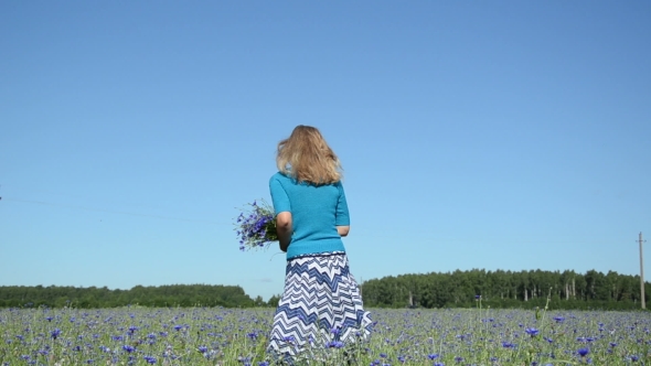 Girl Spin Playful With Cornflower Bouquet In Flowers Field