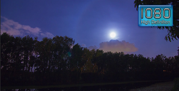 Full Moon Rise Over Swamp with Storm Clouds