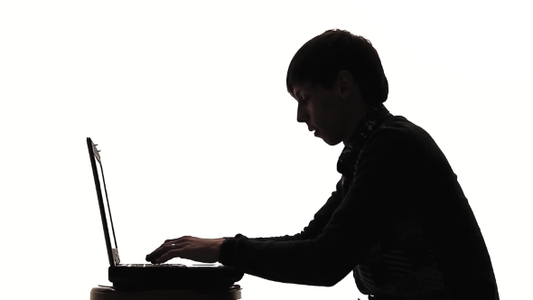 A Man Working At a Laptop Silhouette Joy