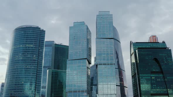 Aerial Drone Tilt Up Shot Close Up of Top Moscow City Skyscrapers