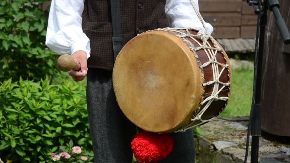 Drummer Play Folk Music With Drum And Stick In Village Party