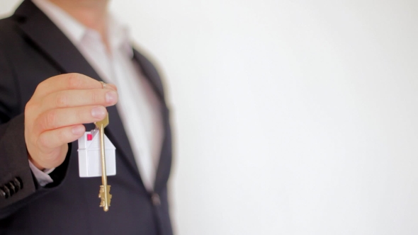 Key To a New Home. Real Estate. Closeup Hand alt