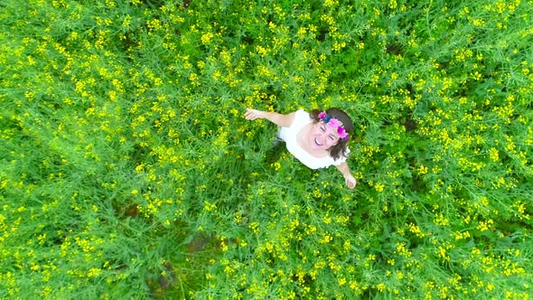 Happy Woman in Rape Field alt