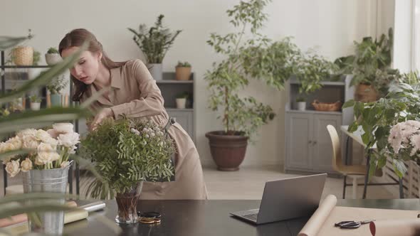Female Florist Touching up Flowers alt