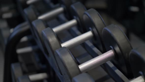 Male Hands Taking the Dumbbell