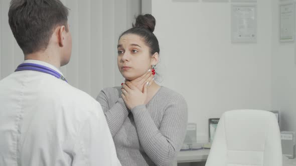 Young Woman with Sore Throat Having Medical Appointment at the Hospital alt