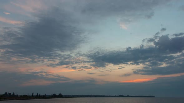 Beautiful Sunrise Of The Summer Sun With Beautiful Clouds In The Sky, Over The River, Timelapse