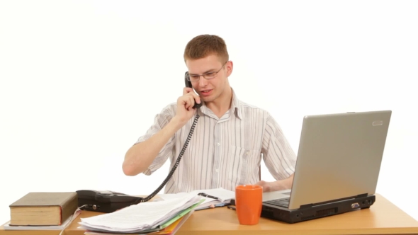 Manager Talks On The Phone In Office
