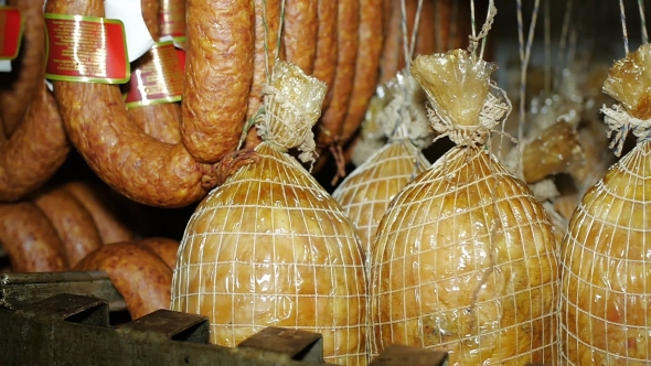 Ready-made Sausages Hanging In The Store Freezer Waiting For The Plant To Be Distributed. Sausage alt