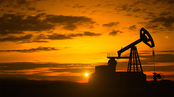 Silhouette Of Crude Oil Pump In Oil Field