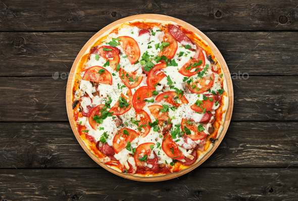 Delicious pizza with mushrooms and smoked sausages - Stock Photo - Images