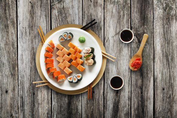 Set of sushi maki and rolls at rustic wood. - Stock Photo - Images