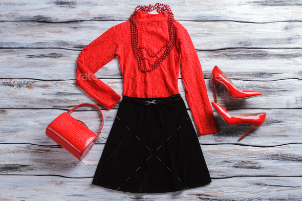 Red top with black skirt. - Stock Photo - Images