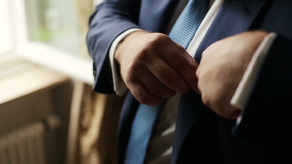 Handsome Groom Puts Handkerchiefs In The Suit. Wedding Preparation