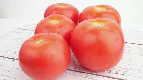 Tomatoes On White Background In Rotation alt