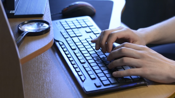 Businessman Working On Laptop Computer At Desk