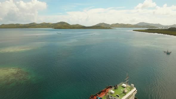 Cargo Ship in the Sea. alt