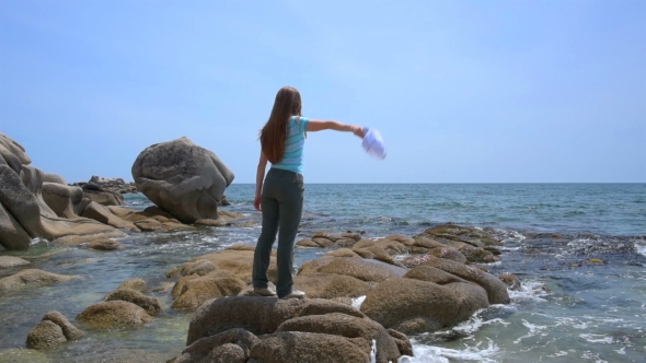 Girl Walking On The Beach