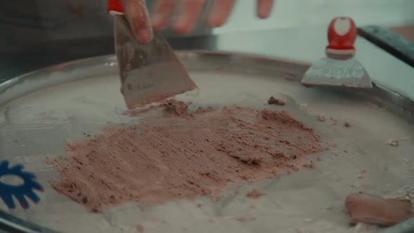 Closeup View of Worker Preparing Fresh Ice Cream During Working Day in Restaurant