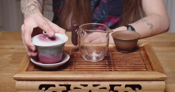 Faceless Caucasian Master Pouring Hot Tea in Chinese Ceremony Slow Motion