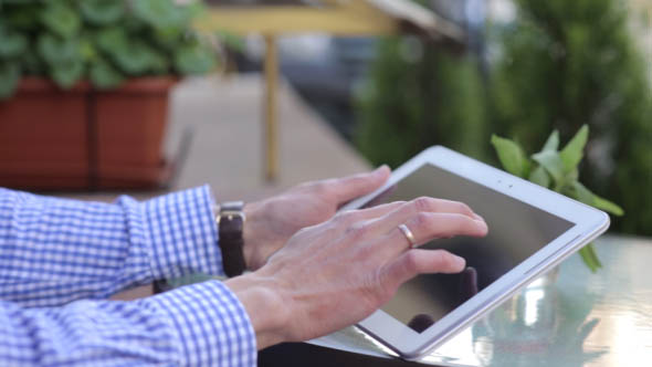 Man Working on the Tablet alt