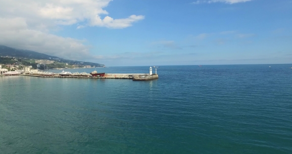 Pier With Lighthouse At The Harbour
