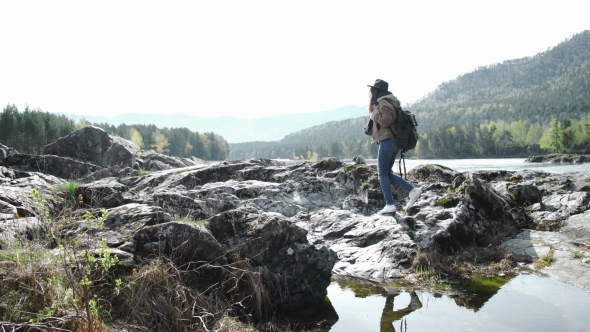 Woman Hiker Taking Photo With Smart Phone at Mountain Peak Cliff alt