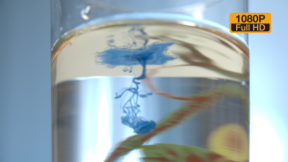 Blue Paint Ink Spread in Glass of Water alt