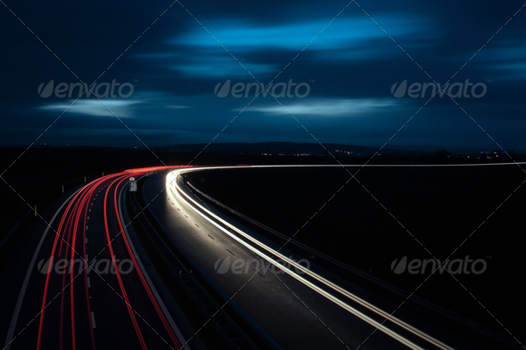 Cars moving fast on a highway - Stock Photo - Images
