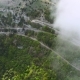 Flying In Clouds Above Serpentine Road - VideoHive Item for Sale