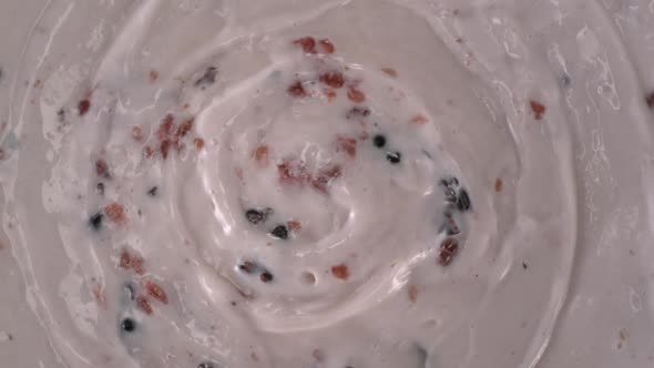 Swirling yogurt that made with red/black raspberries and blueberry