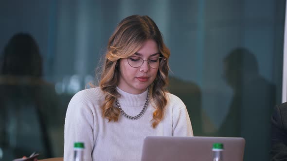 Secretary Girl Typing on Laptop