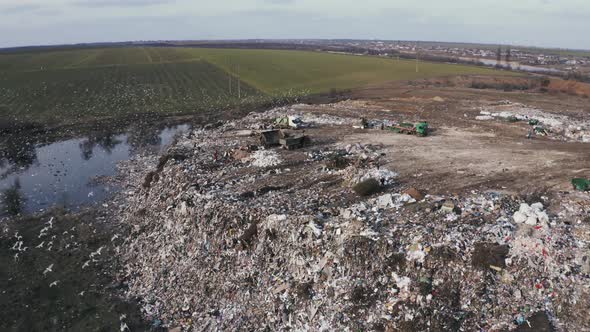 Aerial View on City Rubbish Dump with Flocks of Seagulls alt