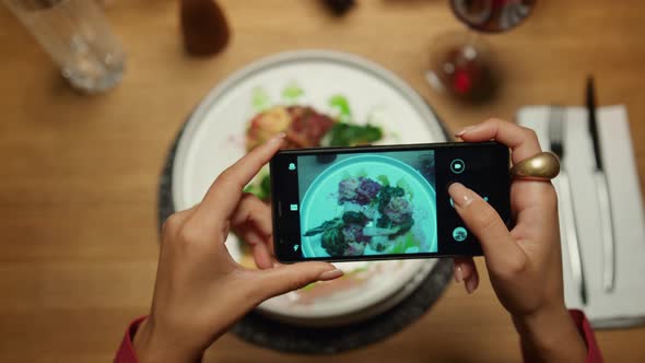 Woman Taking Photos Dinner Using Mobile Phone in Restaurant alt