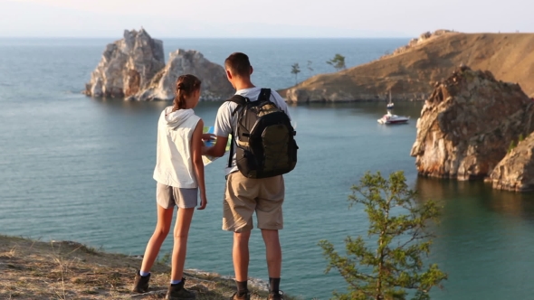 Travel And Hiking Couple Looking At View.
