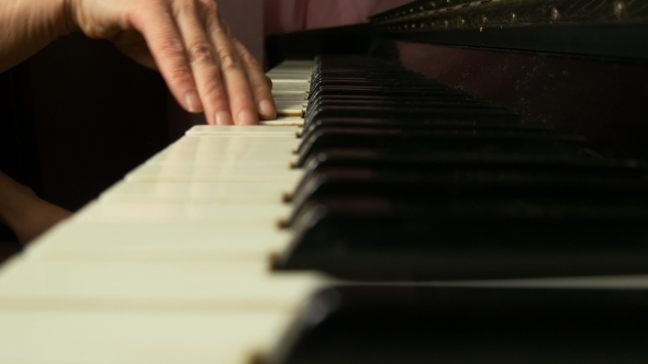Female Hands Playing a Gentle Piece Of Classical Music On a Beautiful Grand Piano alt