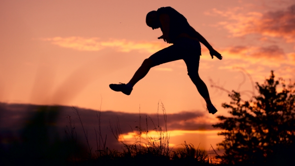 Healthy Young Man Jumping At Sunset, Stock Footage | VideoHive