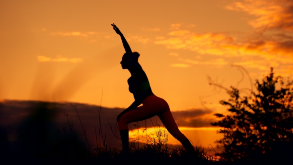 Silhouette Of a Fitness Woman Profile Stretching At Sunrise With The ...