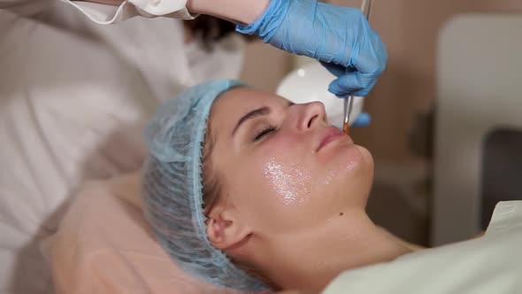 Woman in a Spa Getting Facial Mask alt