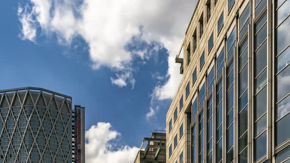 Glass buildings reflecting the clouds