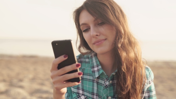 Young Stylish Pretty Woman, Hands Holding a Phone, Denim Shirt And Jeans alt