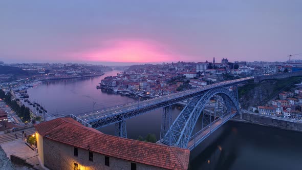 Day To Night View of the Historic City of Porto Portugal Timelapse with the Dom Luiz Bridge alt