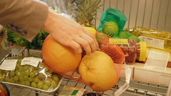 Shopping Trolley Being Filled With Groceries And Healthy Food alt