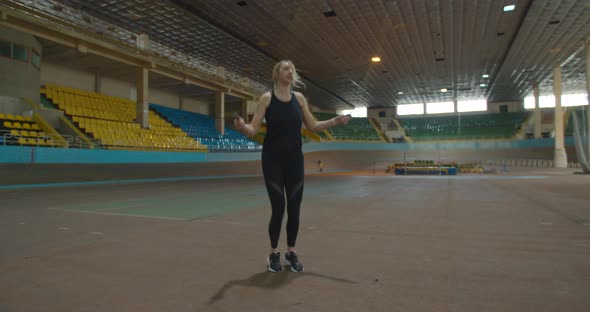 Skipping Woman Training at the Gym Working Out is Healthy Fitness Body alt