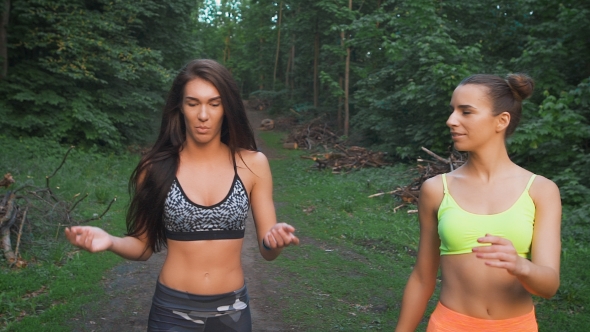 Beautiful Young Women Walking Outdoors. alt