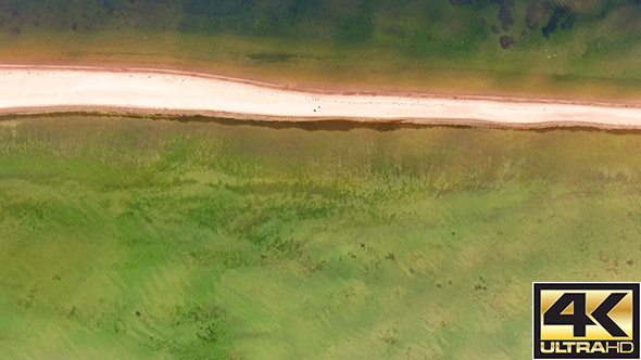  Calm Sea with Clouds Reflecting in the Water alt