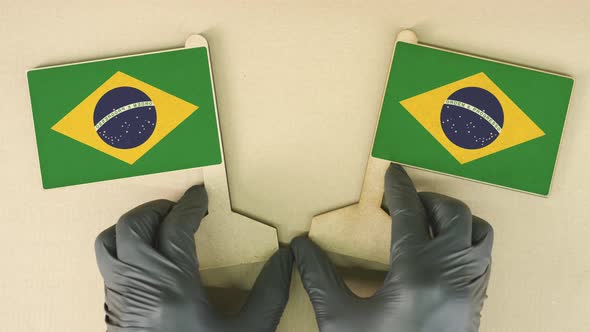 Flags of Brazil Made of Recycled Paper on the Table