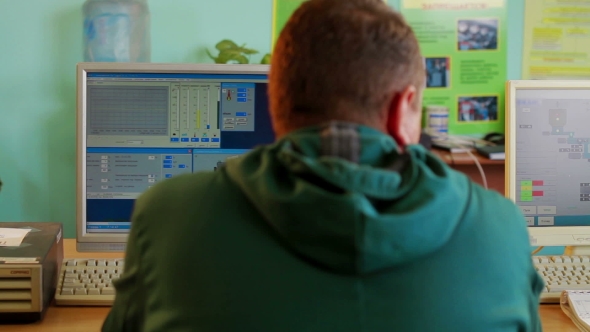 Industrial Worker In Control Room Production Plant alt