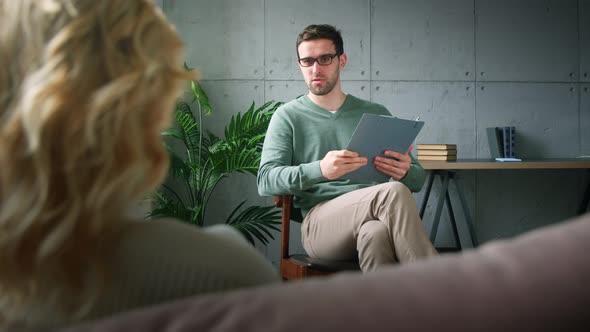Doctor and patient at psychological therapy session alt