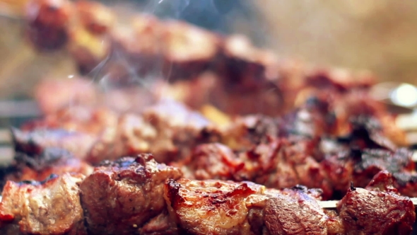 Grilling Barbecue Meat On Wood Coal alt